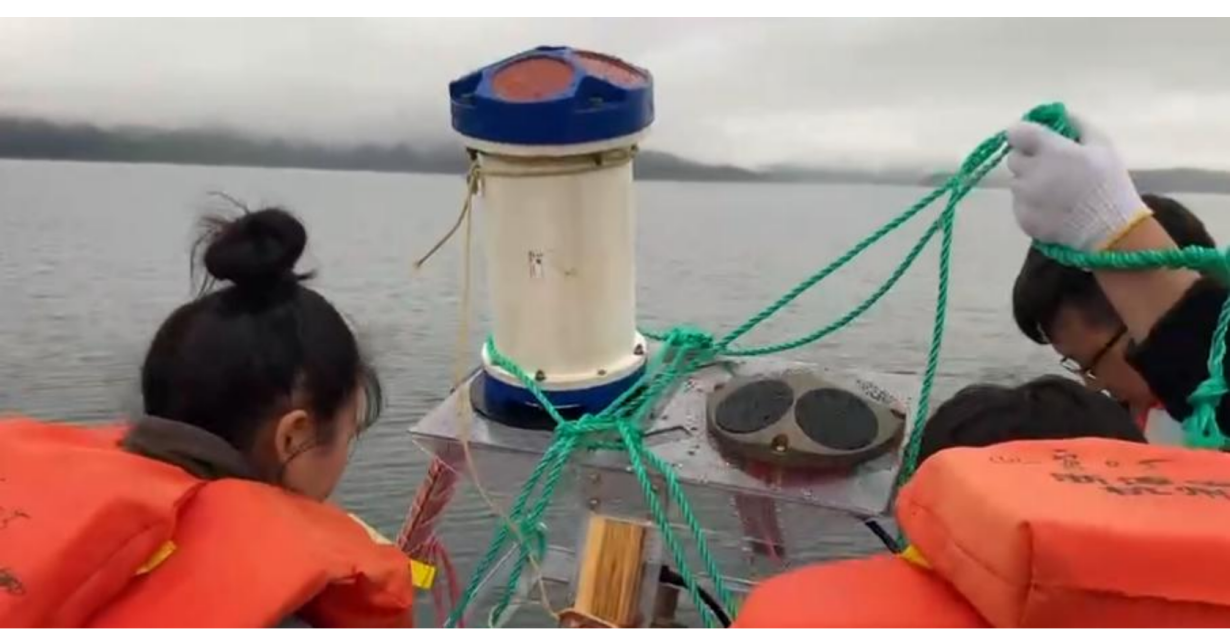 Put the ADCP on the ship and go to the designated location in the lake for deployment.